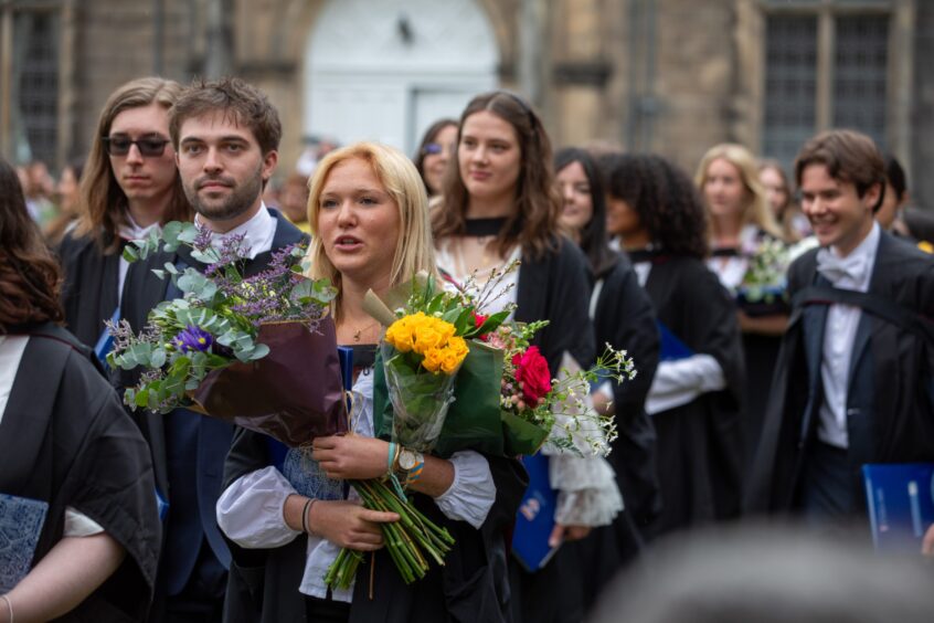 The procession makes its way along North Street to the University Quadrangle where students celebrate with their families.