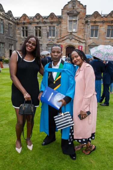 PhD Earth and Environmental Sciences graduate Claudia Luba, from Tanzania, with sisters Winnie and Grace.