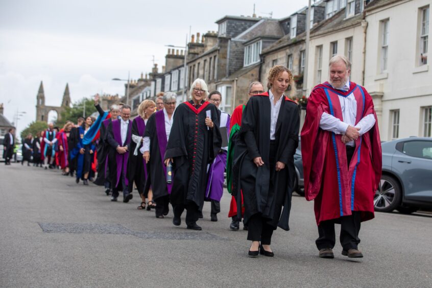 The procession makes its way along North Street.