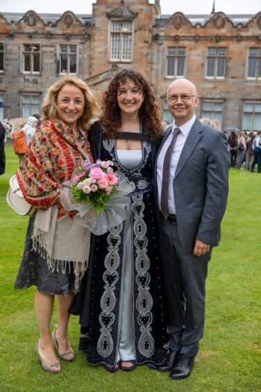 Ekin Çotuk, from Turkey, with her parents.