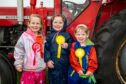 From L-R Lucy Matthews (5), Leah Phillips (5), and Lottie Matthews (2) with their ribbons from the kids running race. Image: Richard Hancox/DC Thomson