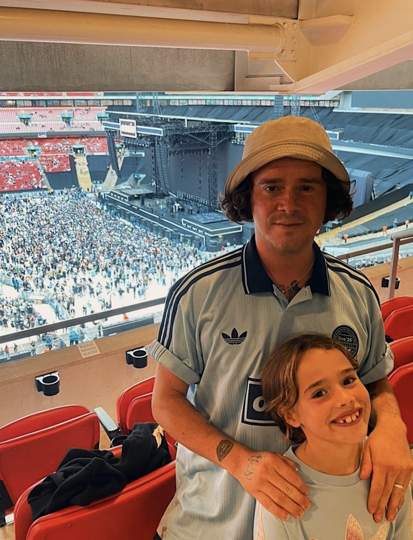 Kyle Falconer with his eldest daughter, Wylde at the Oasis gig.