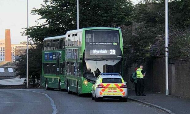 Police at an incident on a bus in Lochee Road, Dundee.