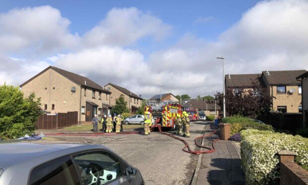 Firefighters at the scene in Roslin Gardens. Image: James Simpson/DC Thomson