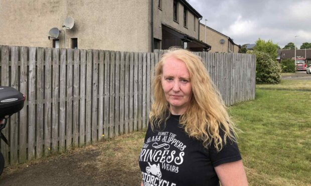 Lorraine Wilson outside her home in Roslin Gardens, Dundee.