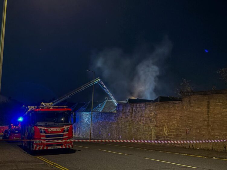 Smoke was seen billowing from the building as firefighters tackled the blaze.