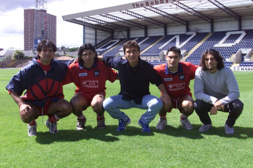 New Dundee FC signings Marcello Marrocco, Fabian Caballero, Ivano Bonetti, Juan Sara and Marco De Marchi pose for a picture on the Dens Park pitch on a sunny day