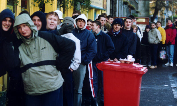 A line up of Oasis fans in Dundee.