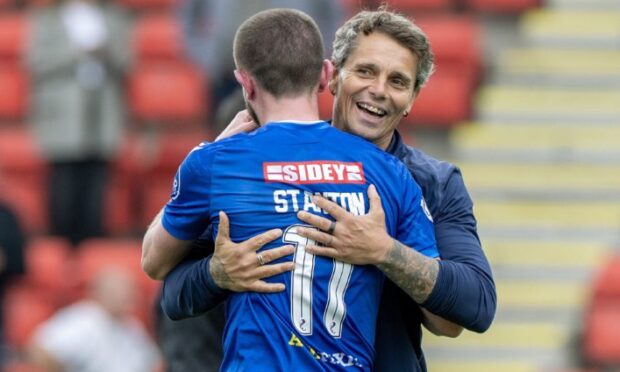 Simo Valakari celebrates with Sam Stanton after the 8-0 win.