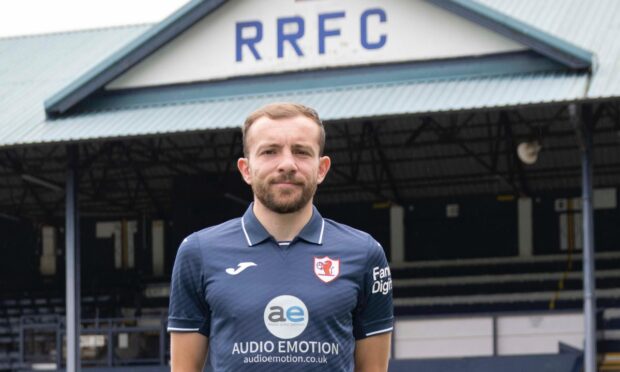 Paul McMullan in front of the main stand at Stark's Park.