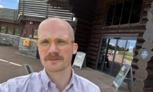 Jacob Smith standing outside the Room With A View Restaurant