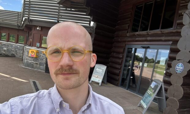 Jacob Smith standing outside the Room With A View Restaurant