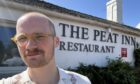 Jacob Smith standing outside The Peat Inn.