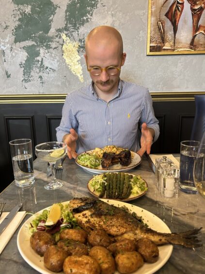 Jacob Smith preparing to eat some food.
