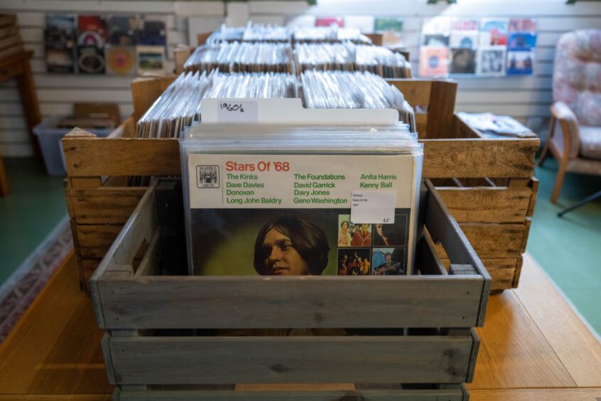 Crate full of records, front record is called Stars of 68