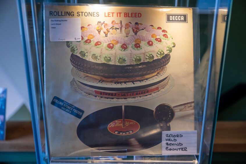 Sleeve of Rolling Stones' Let it Bleed album in display case at Foot of the Mountain Records