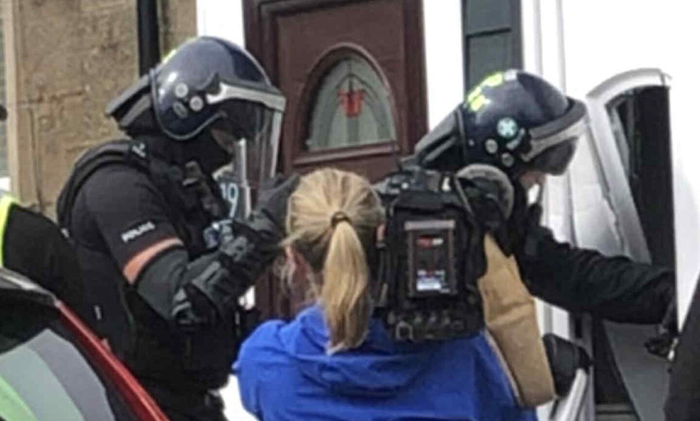 Police raid a Dundee property.