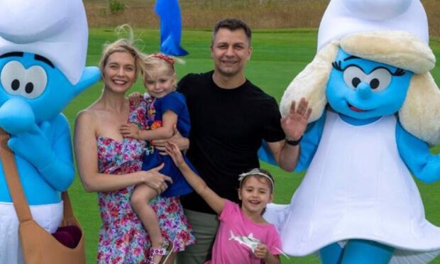 Countdown presenter Rachel Riley and former JLS singer Aston Merrygold joined two Smurfs at the eighth hole of the Torrance Course in St Andrews.