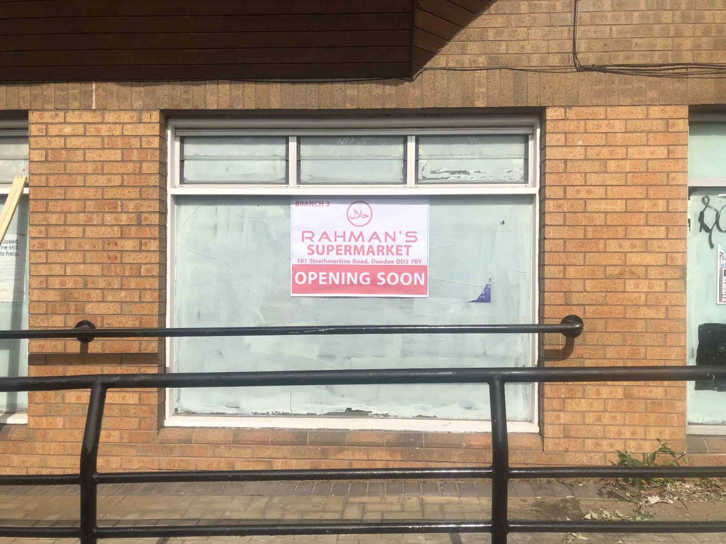 A sign confirming Rahman's Supermarket is opening soon on Strathmartine Road.