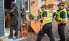 Police raided addresses across Dundee. Image: Steve MacDougall/DC Thomson