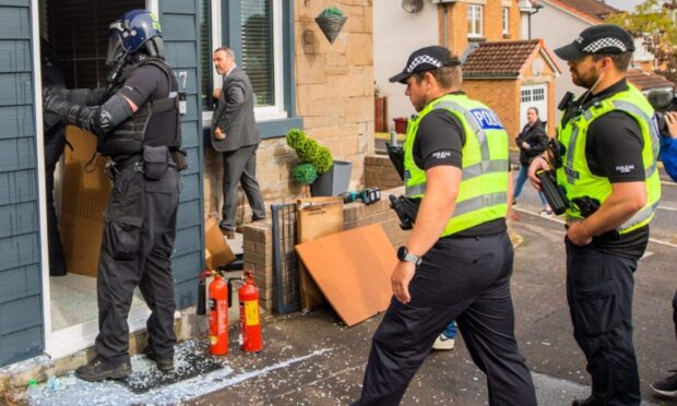Police raided addresses across Dundee. Image: Steve MacDougall/DC Thomson