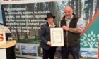Scottish Land & Estates chief executive Sarah-Jane Laing presents Grant Stephen with his long service award.