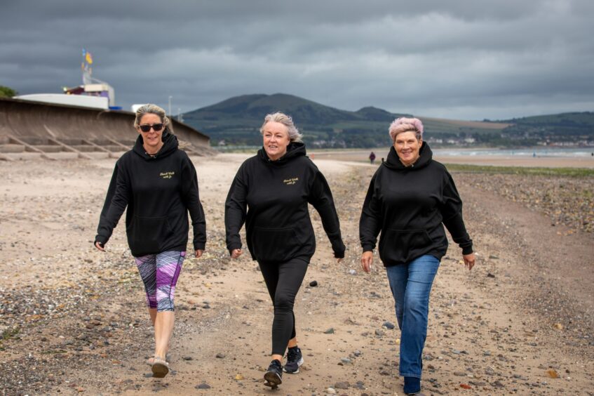Beach Walk with Jo members, Claire Bease, Jo Duffy (centre) and Wendy Melville at Leven beach.