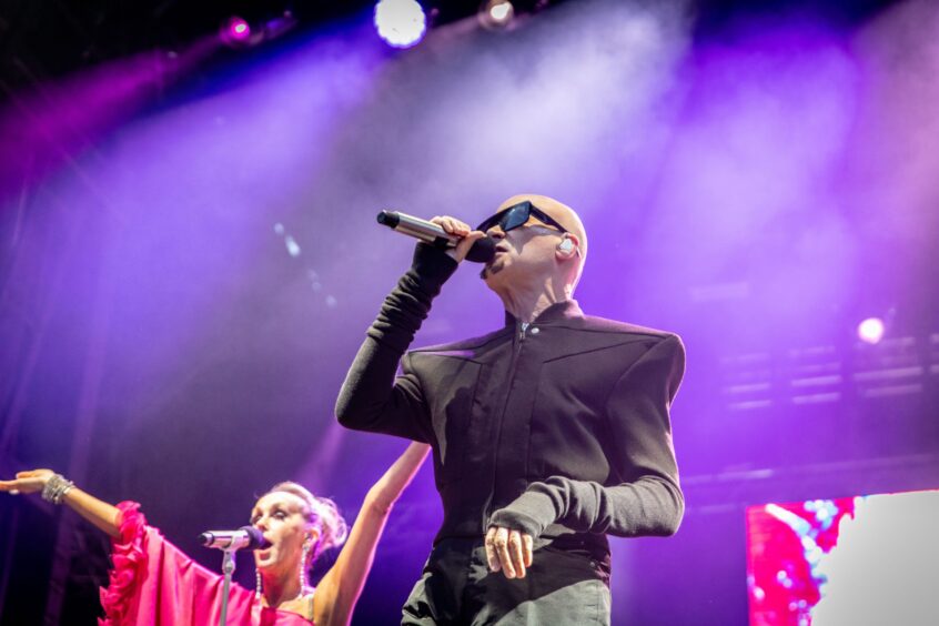 Philip Oakey of The Human League leads the crowds at the Discovery Festival.