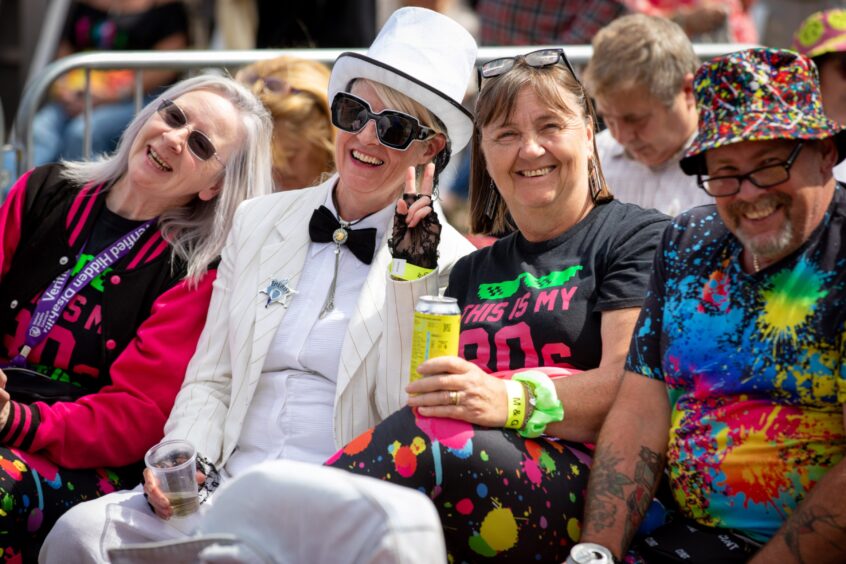 Fans decked out in 1980s-inspired wear for the Discovery Festival in Dundee.