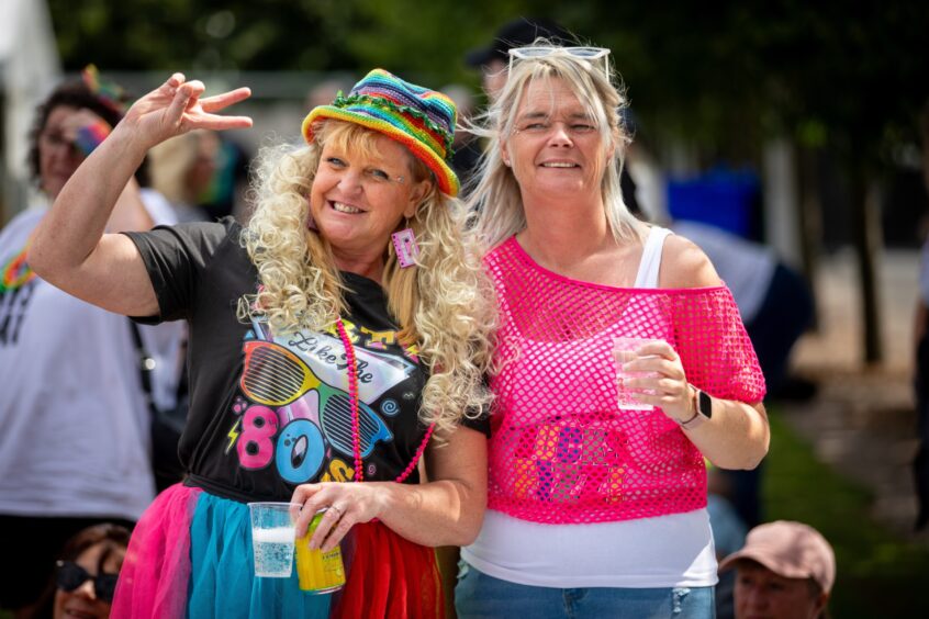 Crowd members toasting the day at Discovery Festival.