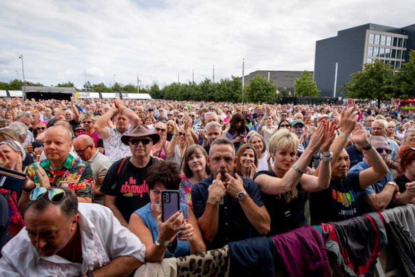 A large crowd of fans clap the performers at Dundee's Discovery Festival.