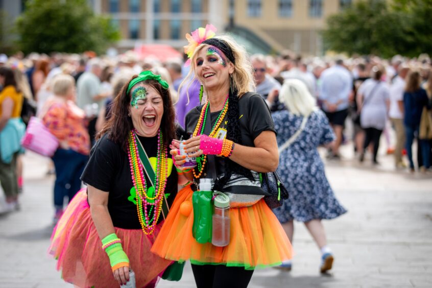 Throwback garb as these music lovers enjoy Dundee's Discovery Festival.