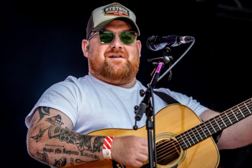 Singer Cammy Barnes with his guitar.