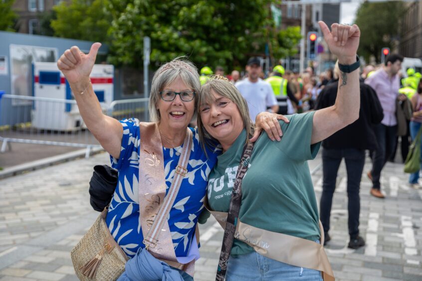 A pair of women heading to see Ocean Colour Scene at Slessor Gardens.