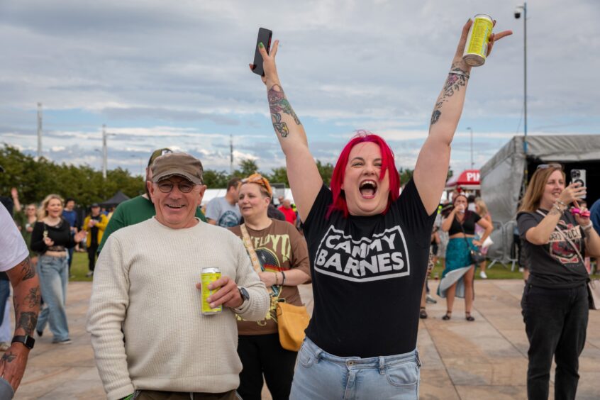 A Cammy Barnes fan enjoys his performance.