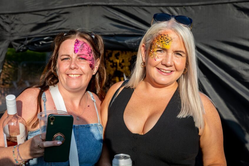 A pair of visitors to the Dundee Discovery Festival show off their face paint.