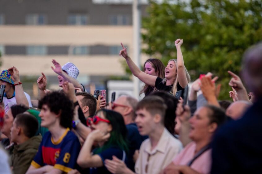 The crowd sing along with the music at Dundee Discovery Festival.