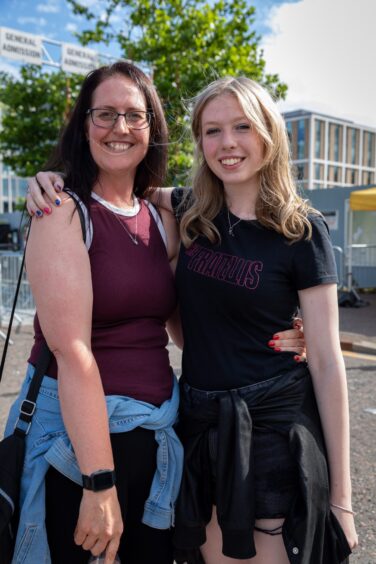A mum and daughter smile at the Discovery Music Festival.