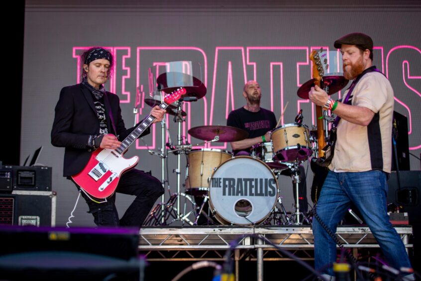 Rock band The Fratellis on stage.
