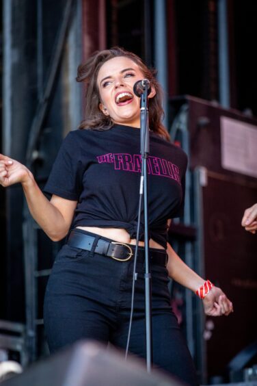 A back-up singer during The Fratellis' performance.
