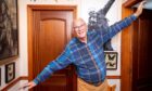 Jim Leishman recreates his famous 'Miracle on Tannadice Street' 'aeroplane' pose at home in Dunfermline.