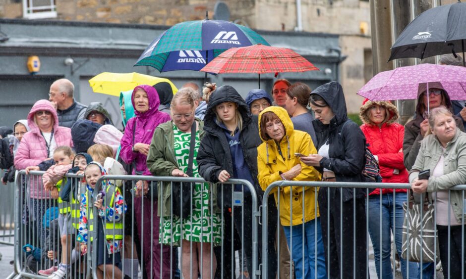The Kirkcaldy public watches the ceremony from across the road