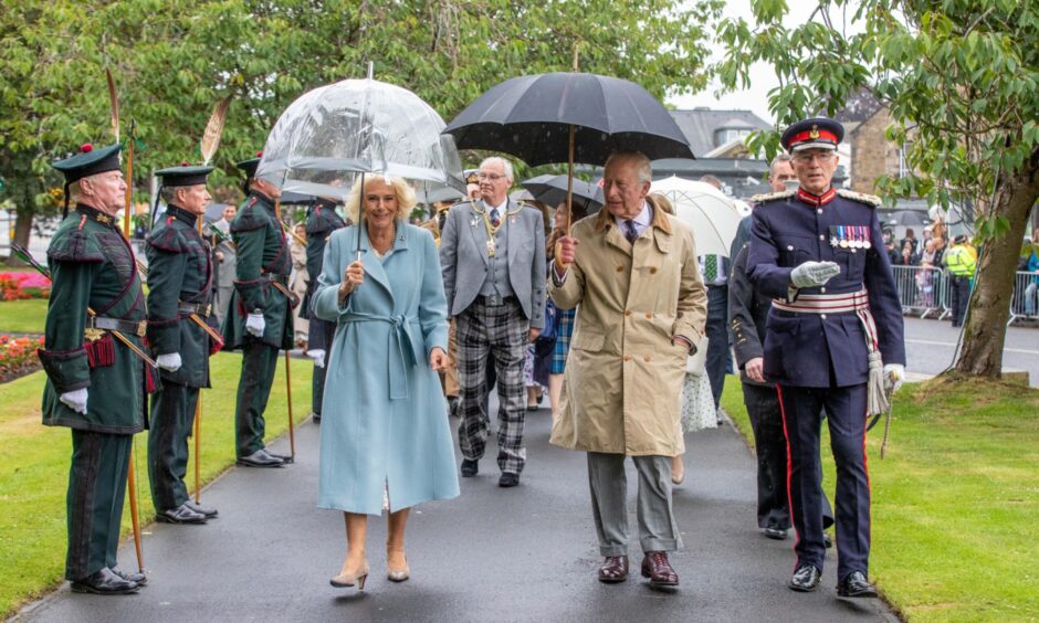The King and Queen, accompanied by Lord Lieutenant Robert Balfour, and Fife Provost Jim Leishman behind.