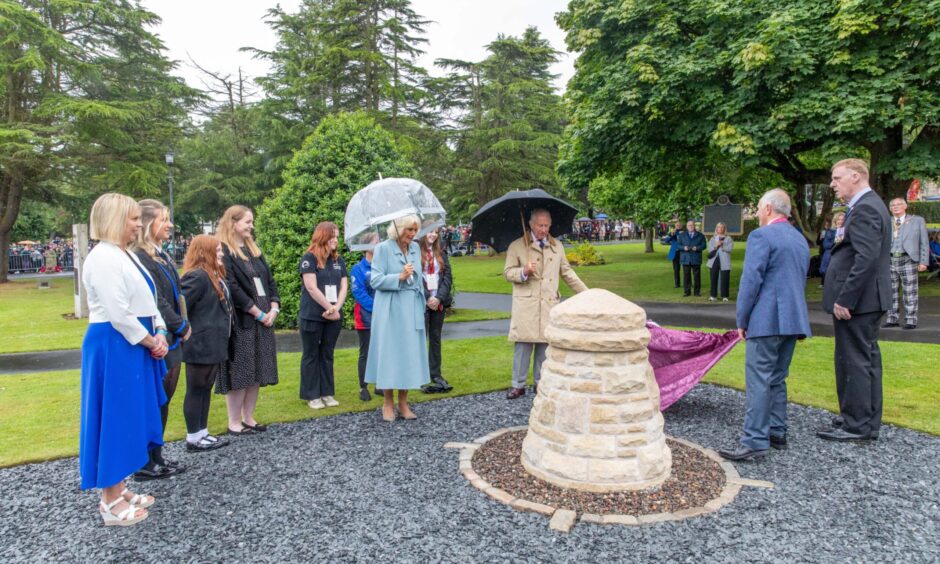 The King and Mr Sweeney unveil the cairn.