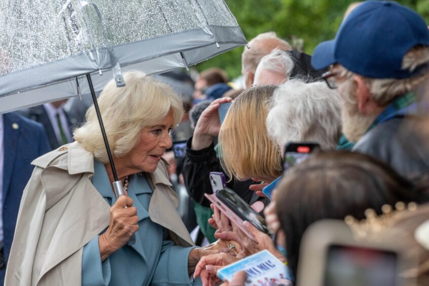 Getting ready to present the Queen with a Mama Mia DVD