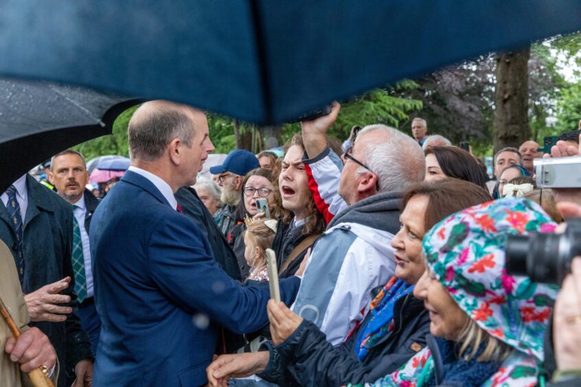 A protester is quickly surrounded