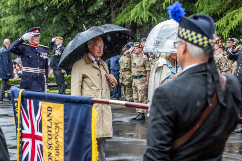 The King during a minute's silence after laying a wreath at Kirkcaldy war memorial