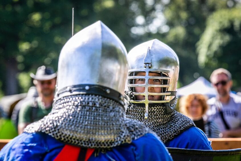 Image shows two men dressed as Medieval soldiers at Perth Highland Games.