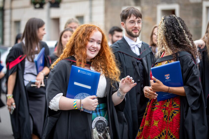 Graduates make their way to St Salvator's Quad after the ceremony at St Andrews University graduation.