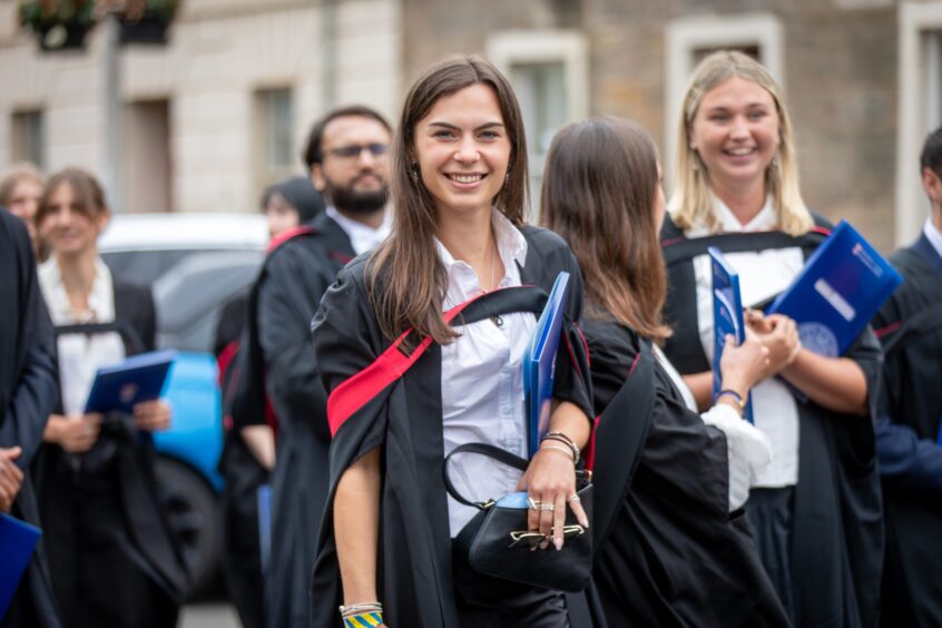 Graduates make their way to St Salvator's Quad after the ceremony at St Andrews University graduation.